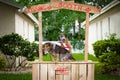 Beagle and Boxer dogs in a kissing booth