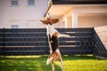 Beagle dog jumping and playing with a ball in green garden park Royalty Free Stock Photo