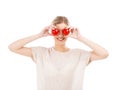 Beaitiful woman with tomatos in front of the face Royalty Free Stock Photo