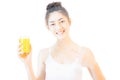 Young beaituful asian woman holding a glass of orange juice  smiling and slim body on white background health care Royalty Free Stock Photo