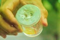 A beaker collects the milked green pit viper venom for produce s Royalty Free Stock Photo