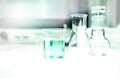 beaker with green solution and Erlenmeyer and round flask in education research science laboratory background Royalty Free Stock Photo