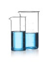 Beakers with blue liquid isolated. Laboratory glassware Royalty Free Stock Photo