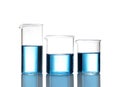 Beakers with blue liquid isolated. Laboratory glassware Royalty Free Stock Photo