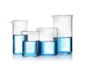 Beakers with blue liquid isolated. Laboratory glassware Royalty Free Stock Photo
