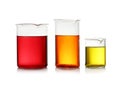 Beakers with color liquid on white. Solution chemistry Royalty Free Stock Photo