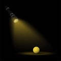 Beam of flashlight light shines on a yellow ball in the dark. Search for answer to question, truth. Loneliness, wandering in dark