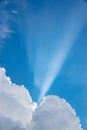 Beam of light through the clouds. Rays of light shining through clouds. Ultraviolet rays concept. vertical Royalty Free Stock Photo