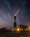 Beam of light from a lighthouse beacon. Dramatic cloudy foggy conditions - Fire Island NY