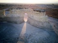 Beam of light shining through Monument Rocks