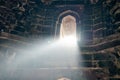 Beam of light from window of ancient indian tomb Bada Gumbad in New Delhi, India, white ray of light