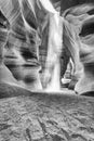 Beam of sand is flowing off the rocks in the interior of the narrow walls of the winding Antelope Canyon, Arizona