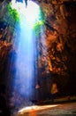 The beam shines down from the channel above the cave at Khao Luang cave ,Petchaburi Royalty Free Stock Photo