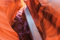 Beam of sun ray and dust between colorful sandstone walls of Upper and Lower Antelope Canyon near Page Arizona