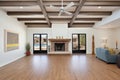 beamed ceilings, kiva fireplace, large windows