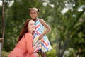 Beaming African-American girl hugging her caring mother