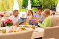 Beaming children giving their grandparents presents Royalty Free Stock Photo