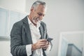 Beaming man feeling happy while reading good wishes