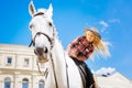 Beaming schoolgirl enjoying her horse riding lesson Royalty Free Stock Photo