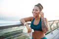 Beaming woman with nice tattoo on arm listening to music Royalty Free Stock Photo