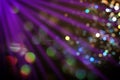 Beams of light in darkness of night club, bokeh effect Royalty Free Stock Photo