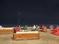 Bean bag chairs and a low table set on the beach Royalty Free Stock Photo