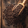 Bean bounty Coffee beans in a wooden scoop on oak