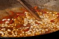 Making some bean food in a cauldron 