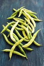 Bean pods on the dark table.