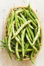 Bean pods on the white table.