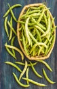 Bean pods in wicker baskets.