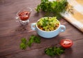 Bean soup, tomatoes, beans, parsley on a wooden table.Flat lay