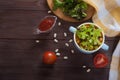 Bean soup, tomatoes, beans, parsley on a wooden table.Flat lay. Copy spaes