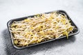 Bean sprout in black plastic container. White background. Top view Royalty Free Stock Photo