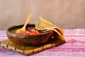 Beans cooked in a clay dish with tomato and tortillas, mexican poor dish Royalty Free Stock Photo