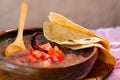 Beans cooked in a clay dish with tomato and tortillas, mexican poor dish Royalty Free Stock Photo
