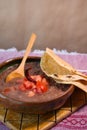 Beans cooked in a clay dish with tomato and tortillas, mexican poor dish Royalty Free Stock Photo