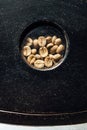 Beans in a glass window in coffee roasting machine Royalty Free Stock Photo