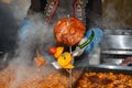 Beans stew, chili sin carne, large pot on fire cooking during food festival Royalty Free Stock Photo