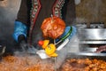 Beans stew, chili sin carne, large pot on fire cooking during food festival Royalty Free Stock Photo