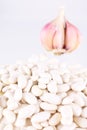 Beans of a string bean against garlick bulb Royalty Free Stock Photo