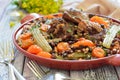 Beans with vegetables and meat on a plate