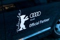 Bear, Berlinale symbol, and Audi logo on a car