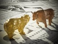 Bear and bull figures on economy newspaper pages. 3D illustration