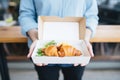 bear claw pastry in a to-go box, cafe branding
