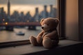 bear doll sitting on windowsill, with the view of the city skyline