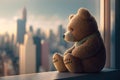 bear doll sitting on windowsill, with the view of the city skyline