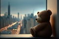 bear doll sitting on windowsill with view of city skyline