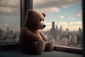 bear doll sitting on windowsill with view of city skyline