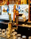 Vertical closeup of the beer taps, glassware and backbar of the lounge at Bear Mountain Inn